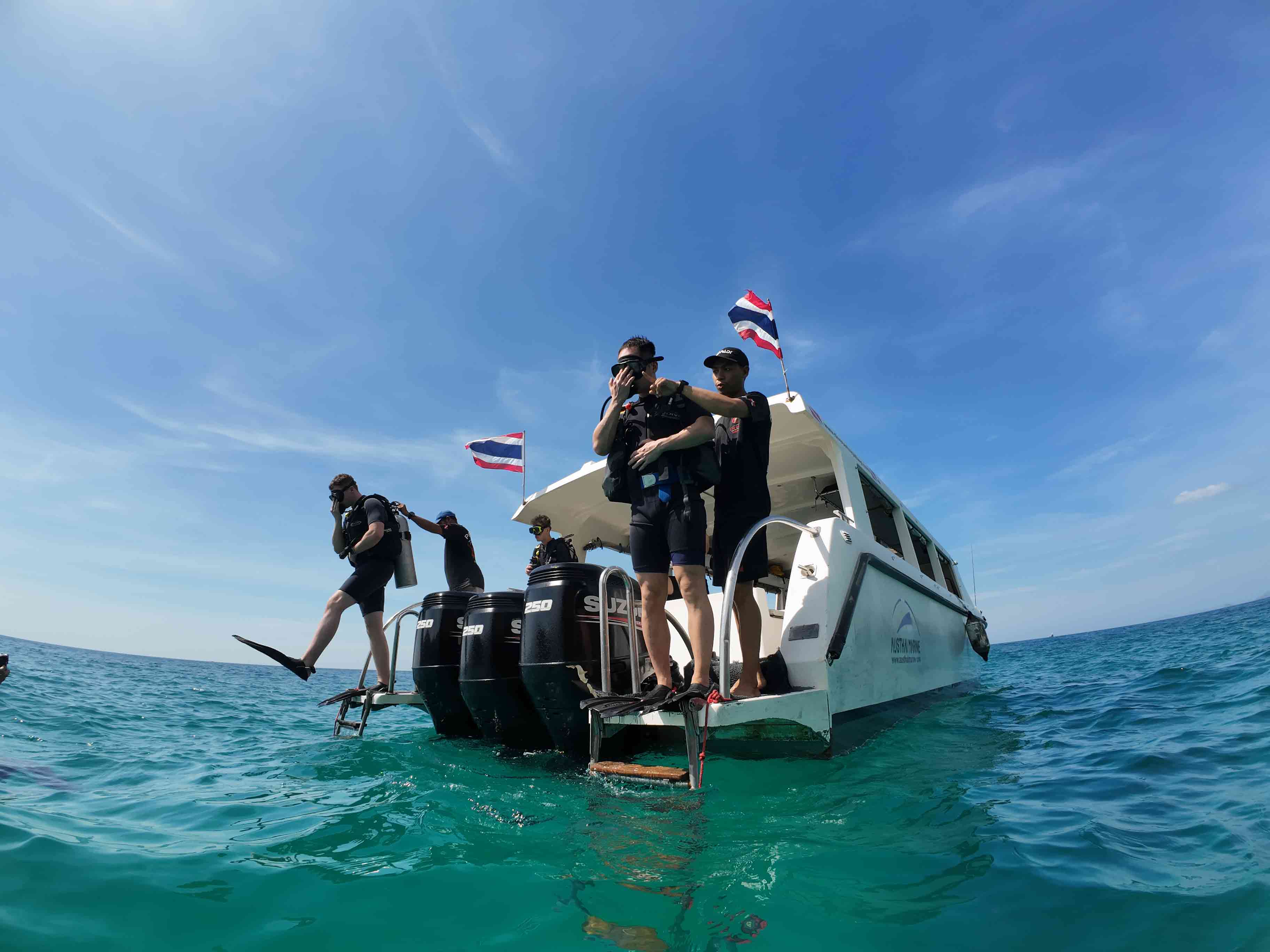 Scuba diver stepping off the dive boat in Pattaya