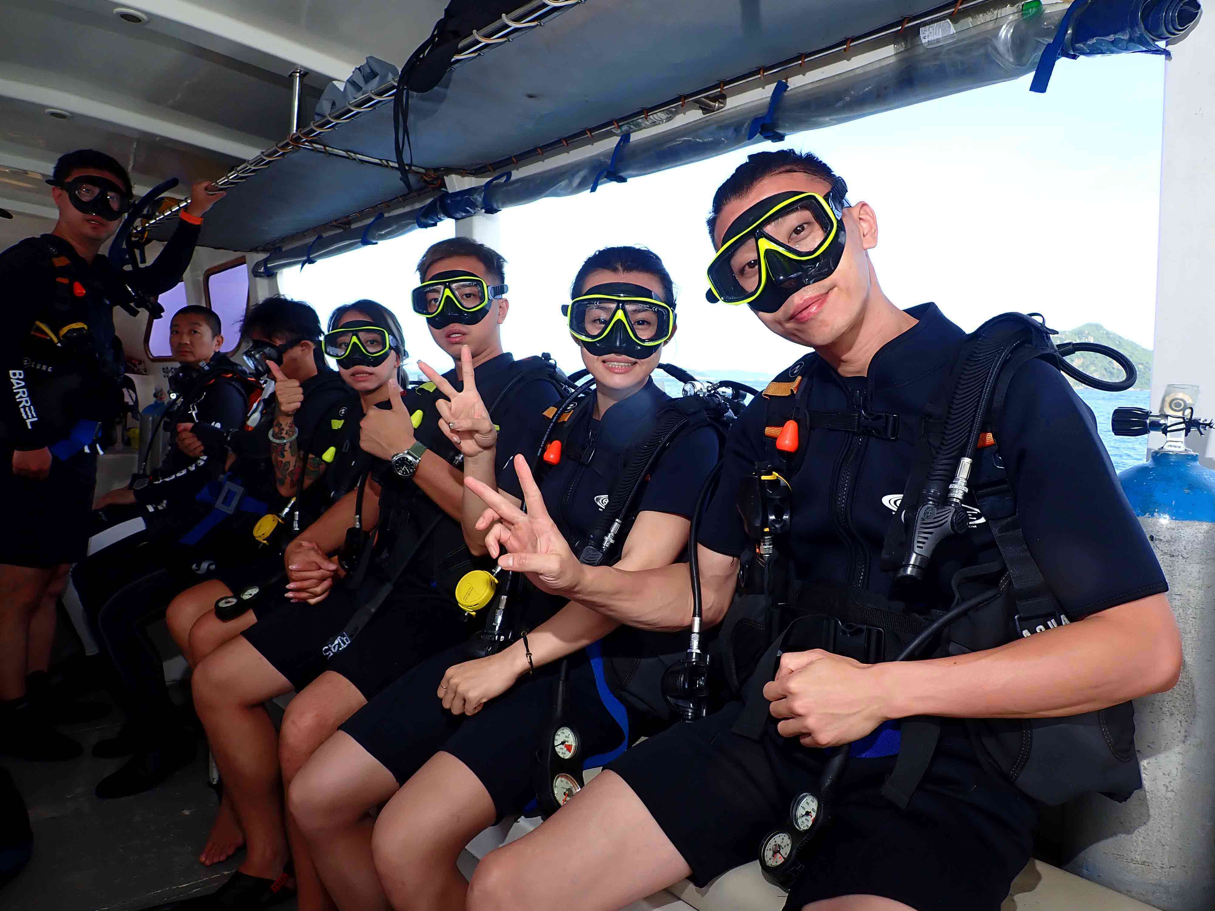 Scuba divers preparing on boat in Pattaya